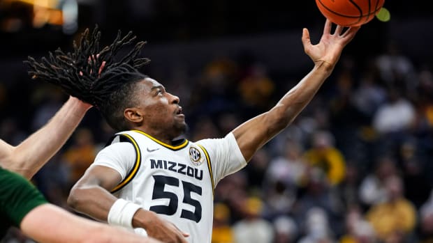 Missouri Tigers guard Sean East II (55) shoots against Loyola (Md) Greyhounds forward Alonso Faure (4) during the second half at Mizzou Arena.